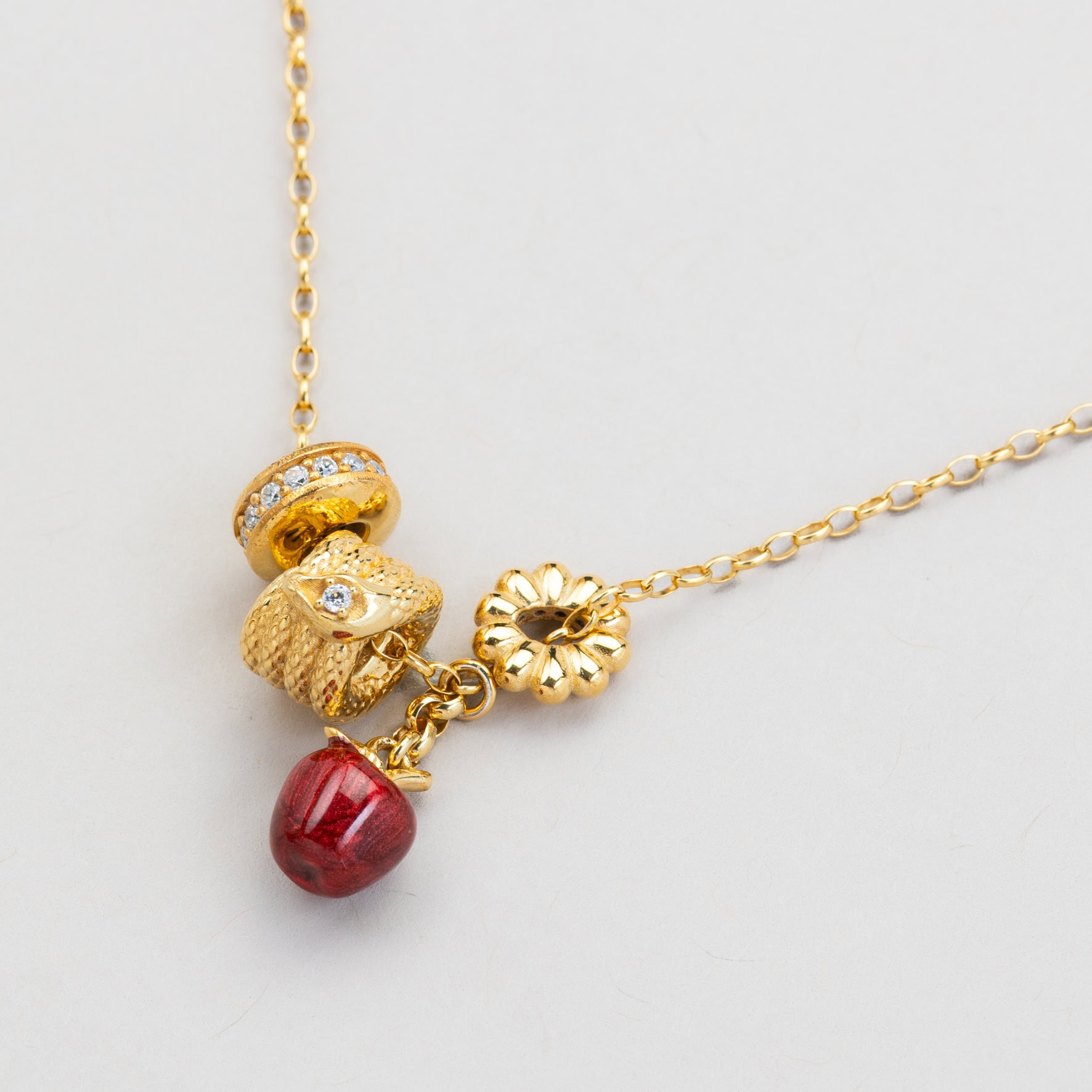 collana rocchetto serpente e mela
